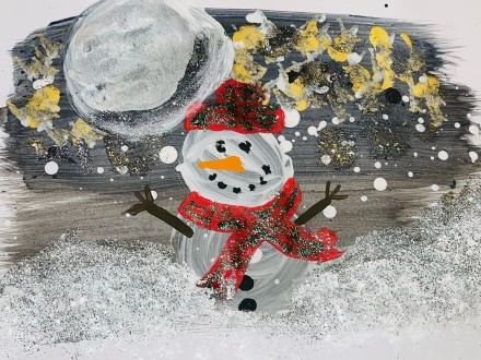 Snowman with a red hat and red scarf, and twigs for arms.